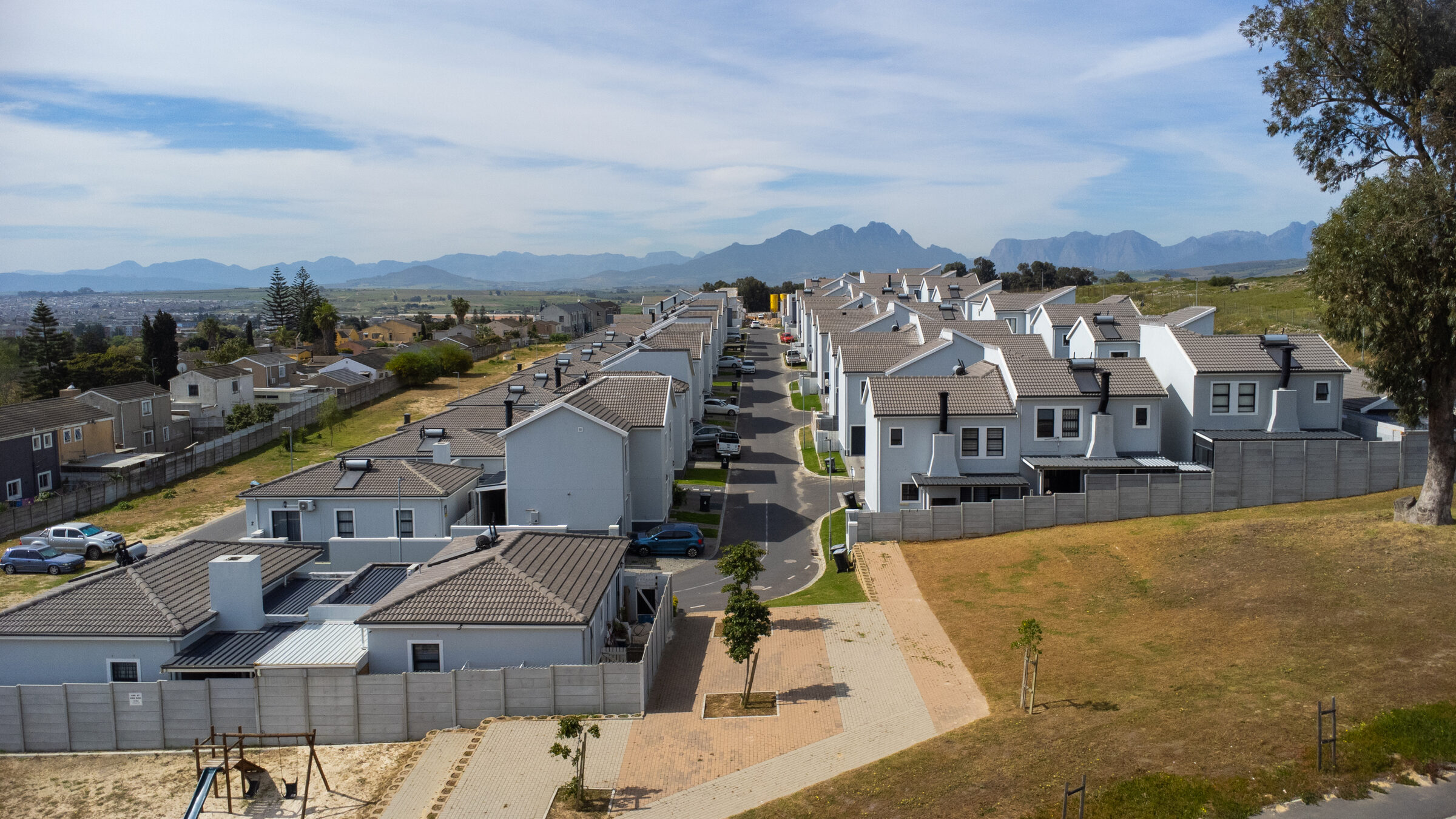 Aerial view over completed Bracken Reserve homes with the Boland mountains behind